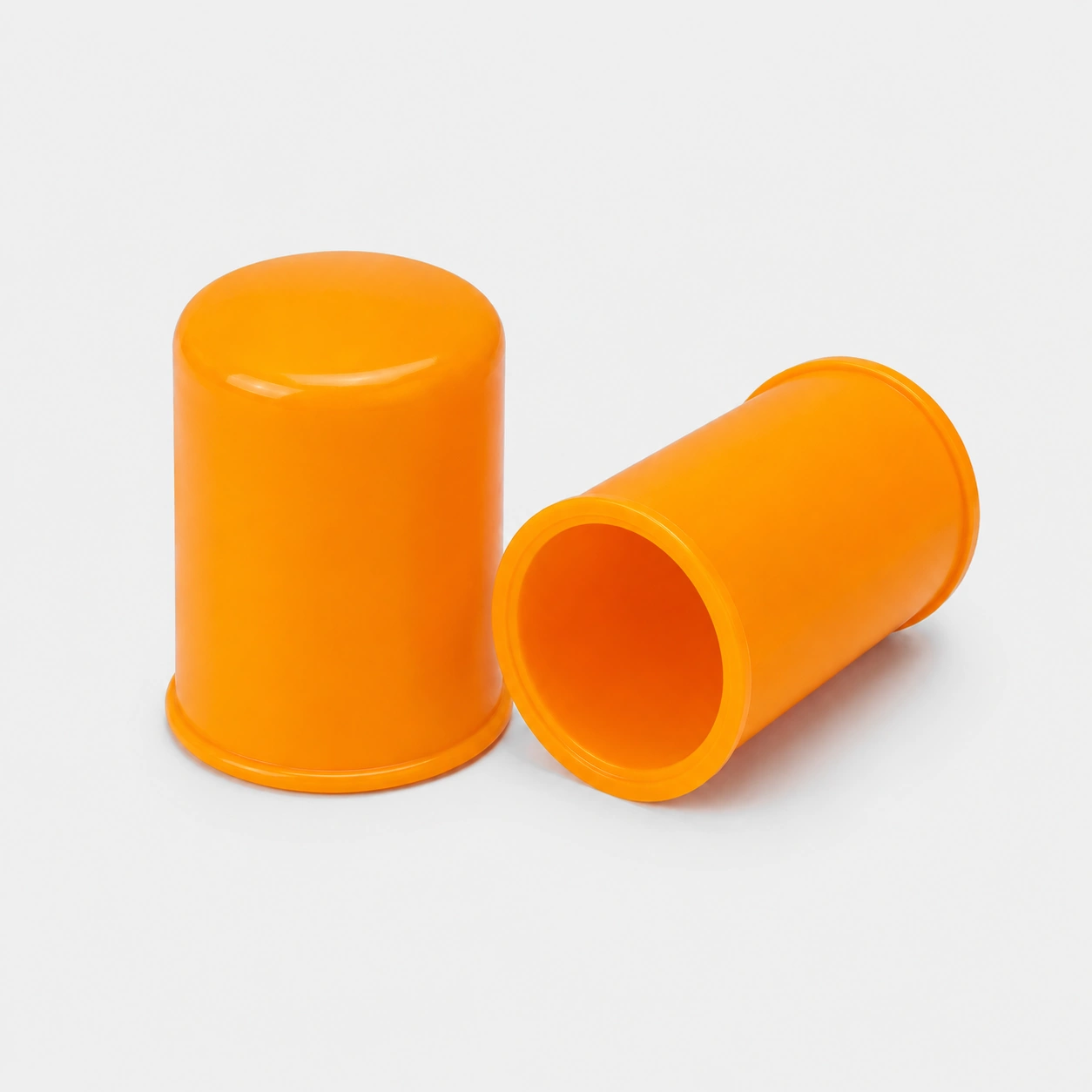 Orange Plastic Caps On Gray Background